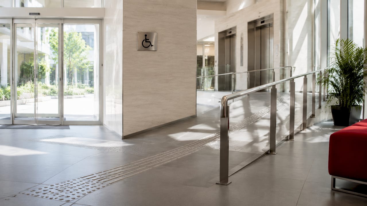Accessible corridor with ramp and elevator entrance