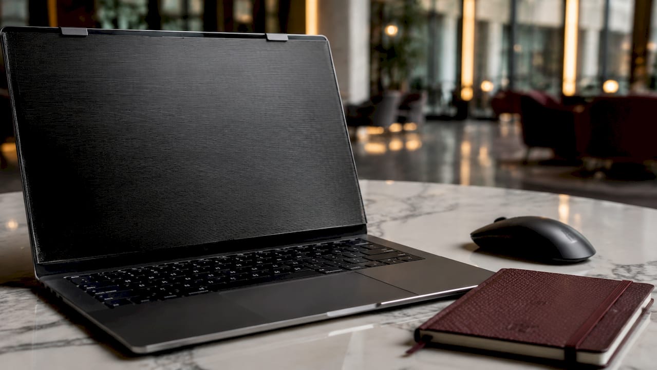 Close-up of laptop privacy filter on desk