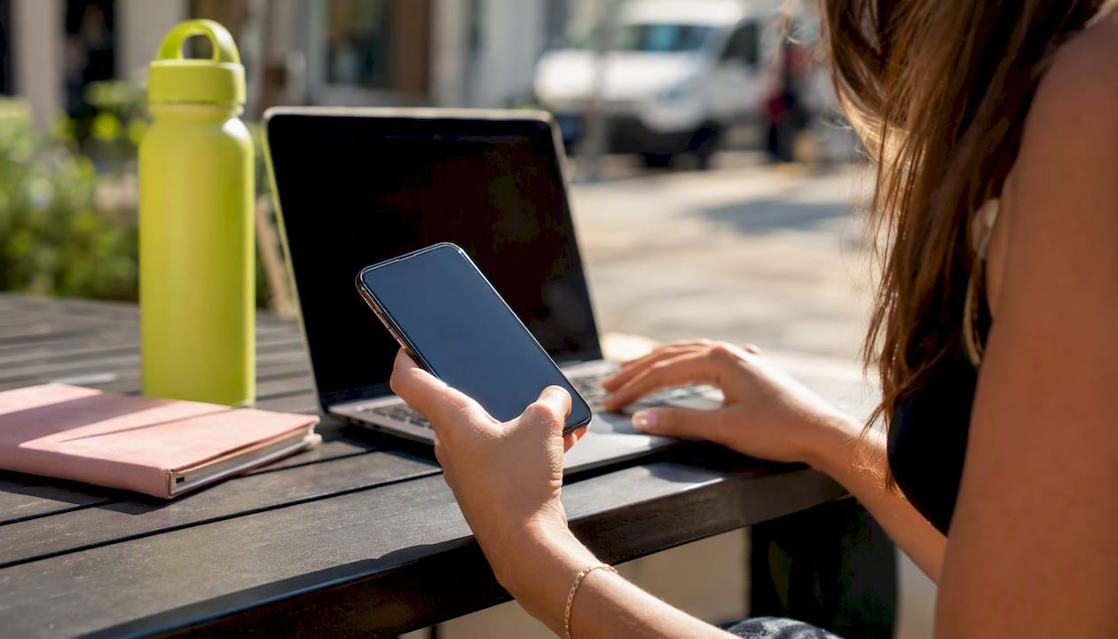 Hand typing address on mobile with autocomplete