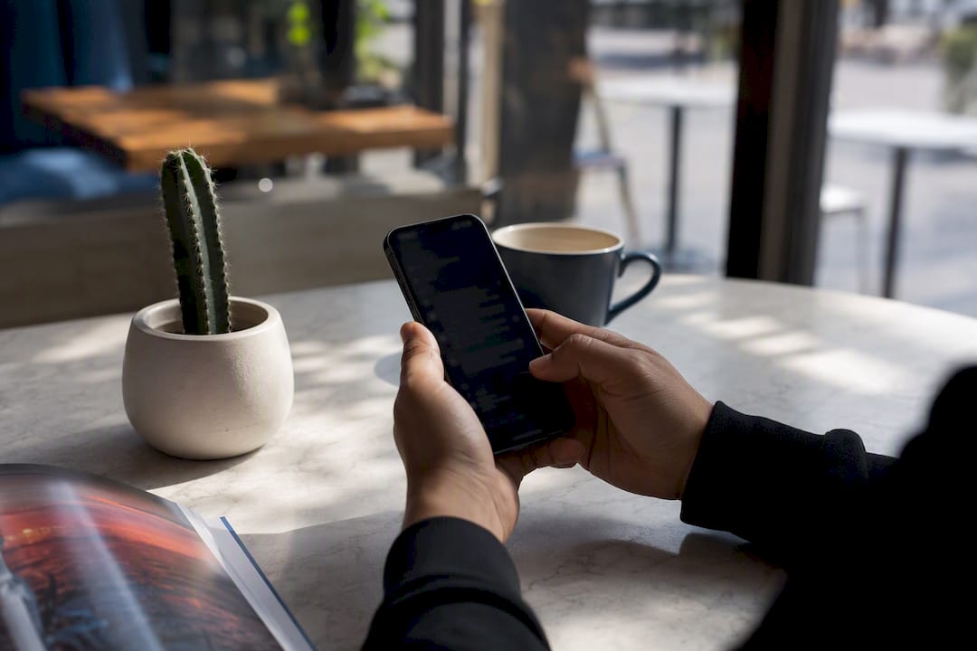 Hand replying to customer review on phone