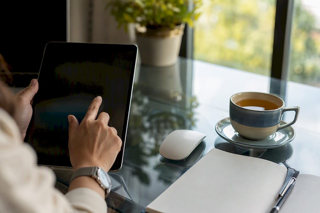 Hands setting up online booking on tablet
