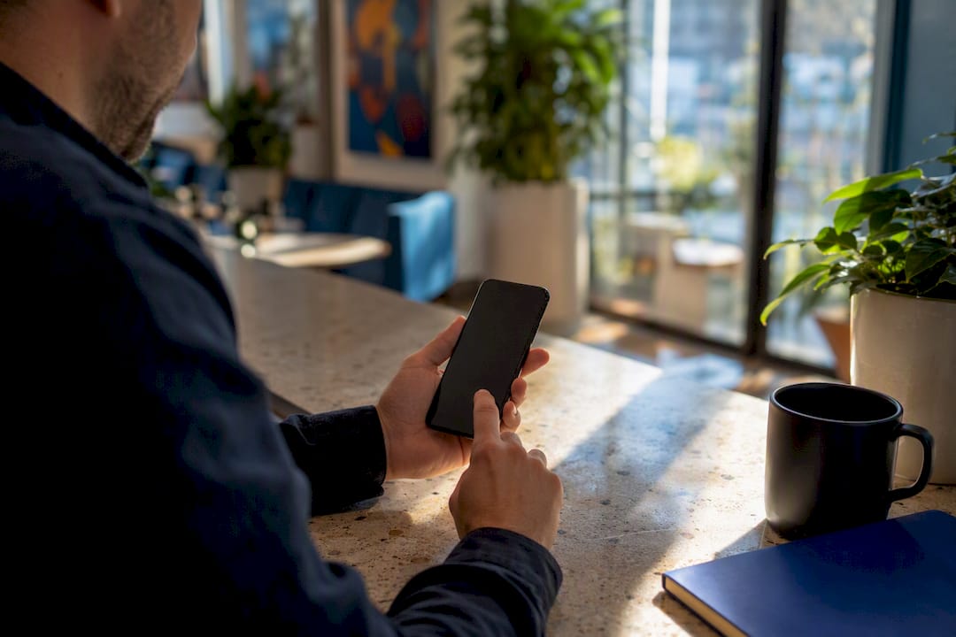 Hands poised to tap mobile testimonial form