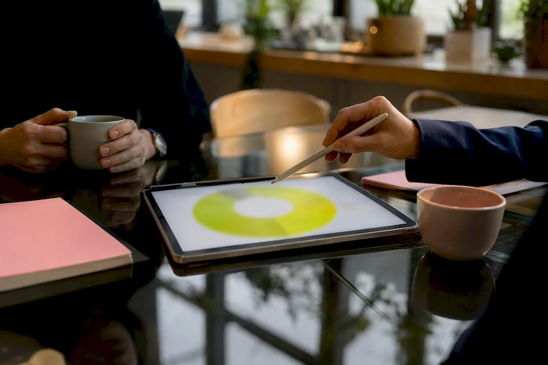Stylus pointing at a donut chart on tablet