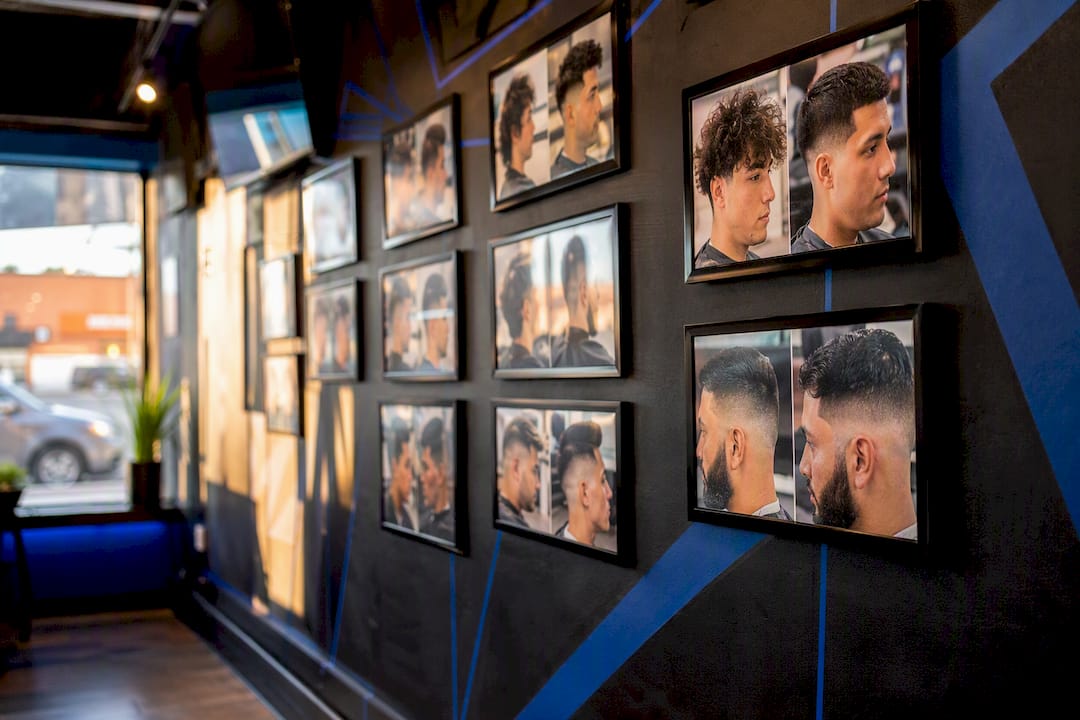 Barbershop wall with framed haircut photos