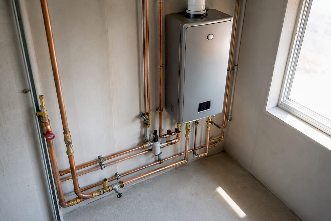 Tankless water heater and connected pipes