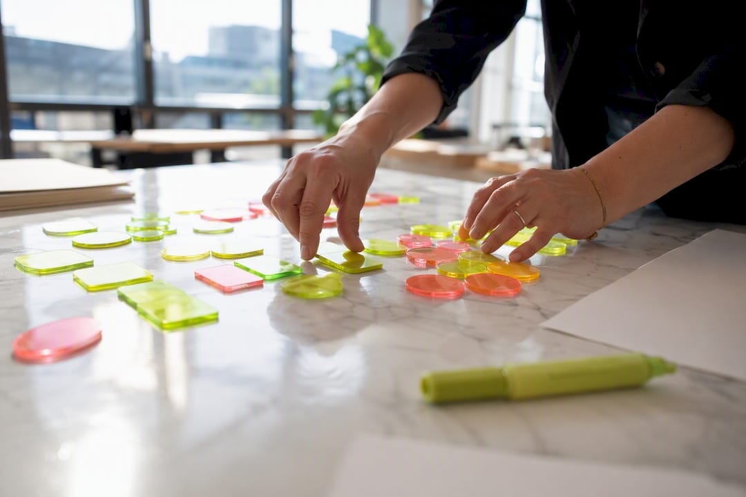 Hands arranging digital content tokens