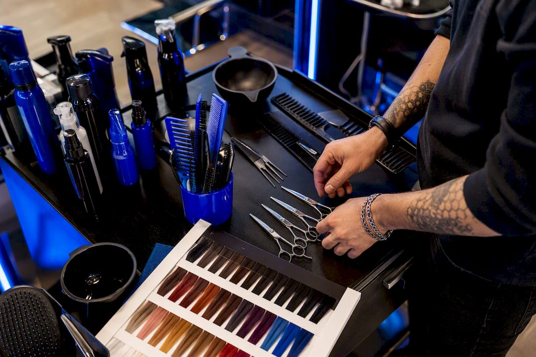 Stylist hands grouping salon service tools