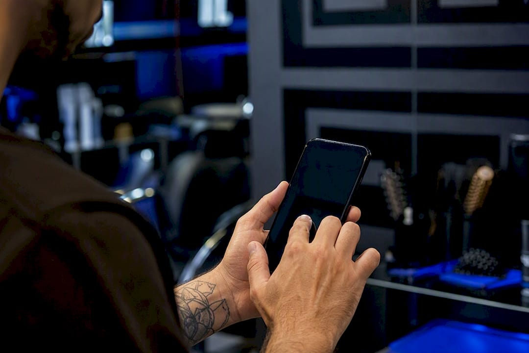 Hand swiping smartphone to change highlight cover