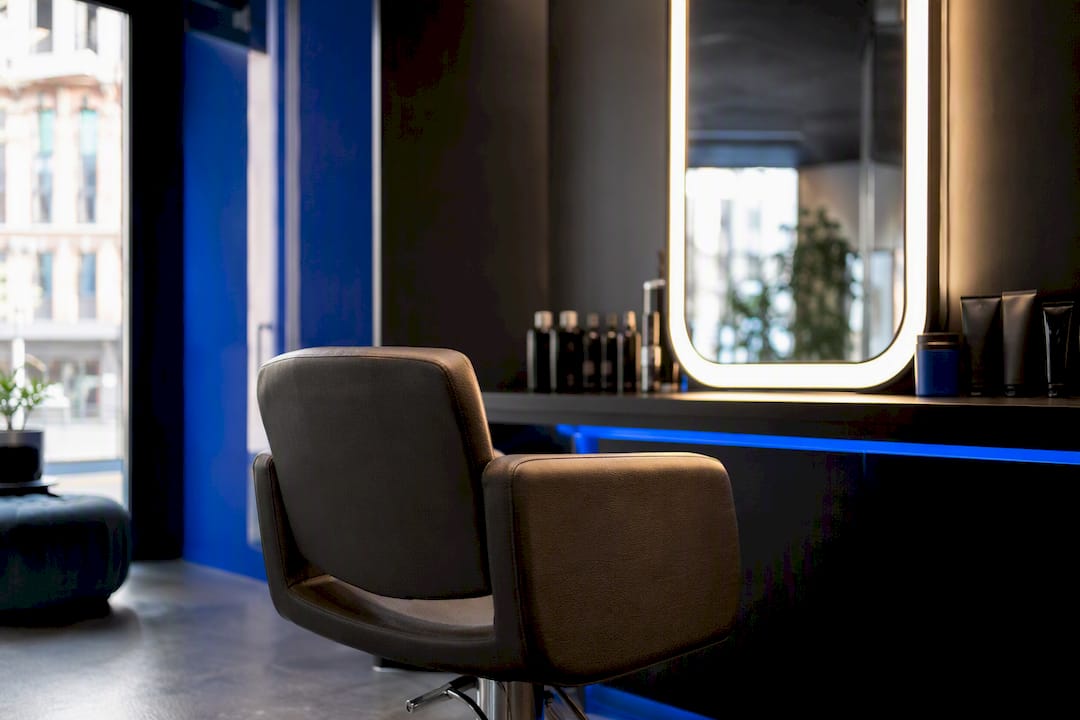 Empty salon chair and mirror after coloring
