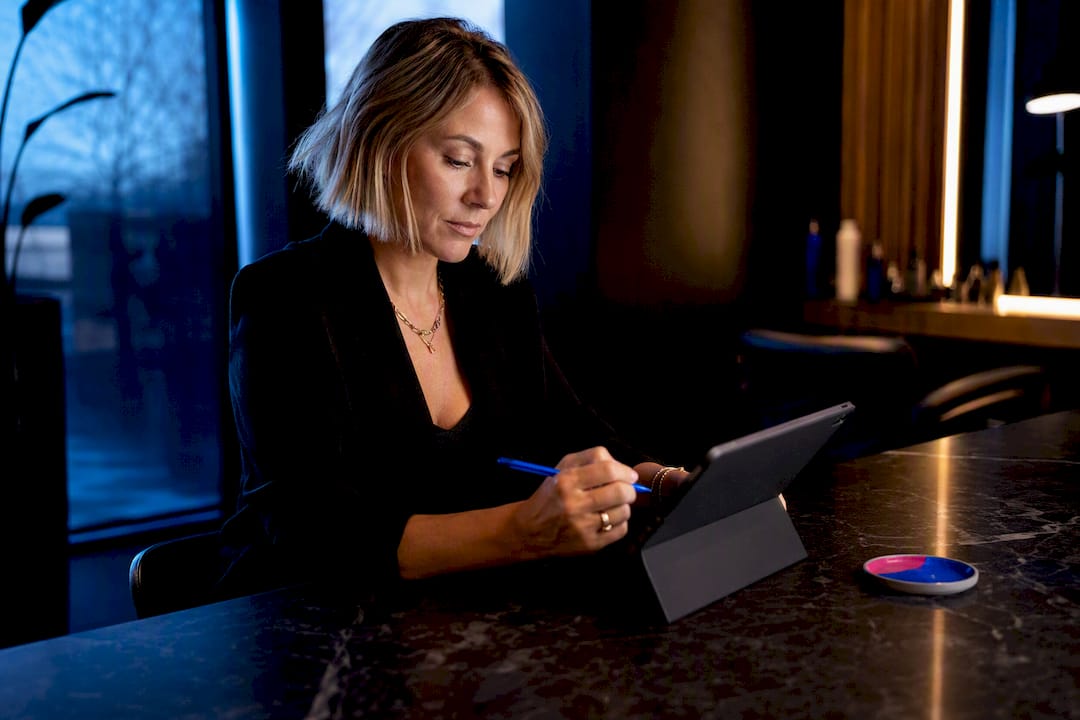 Salon owner writing a service menu description
