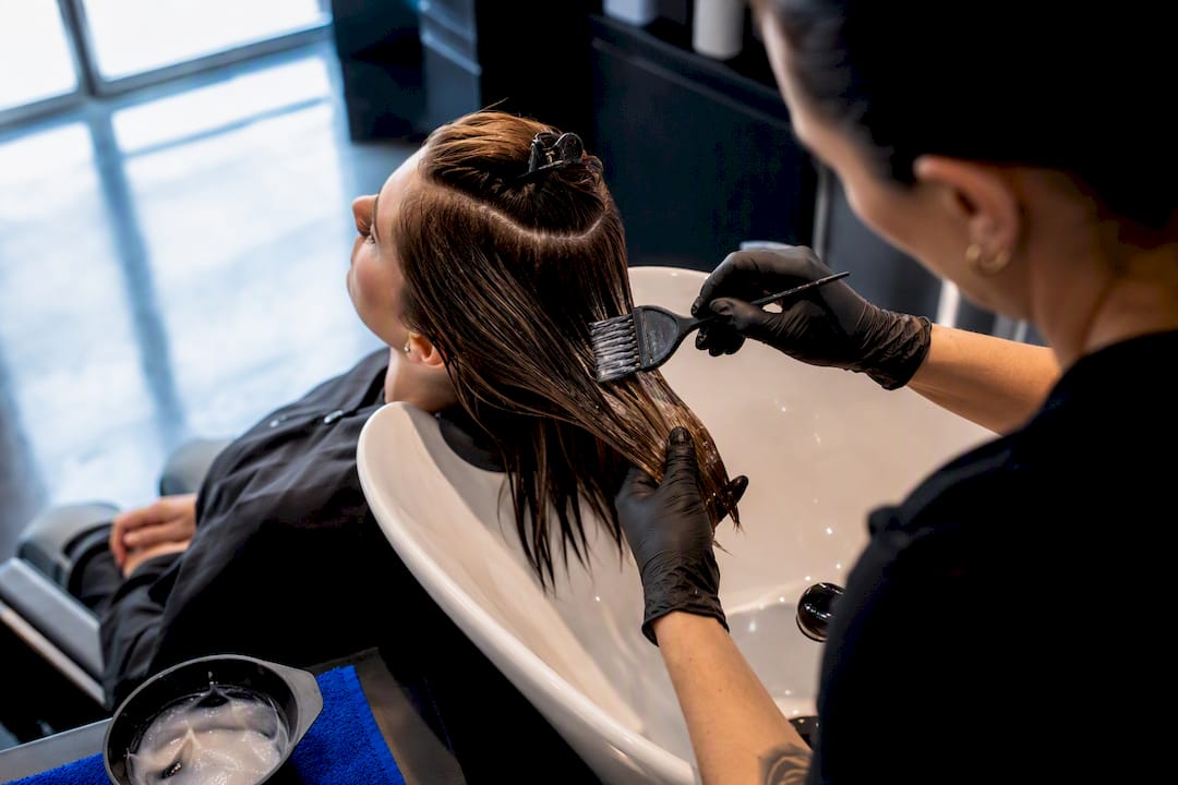 Stylist applying salon bond treatment