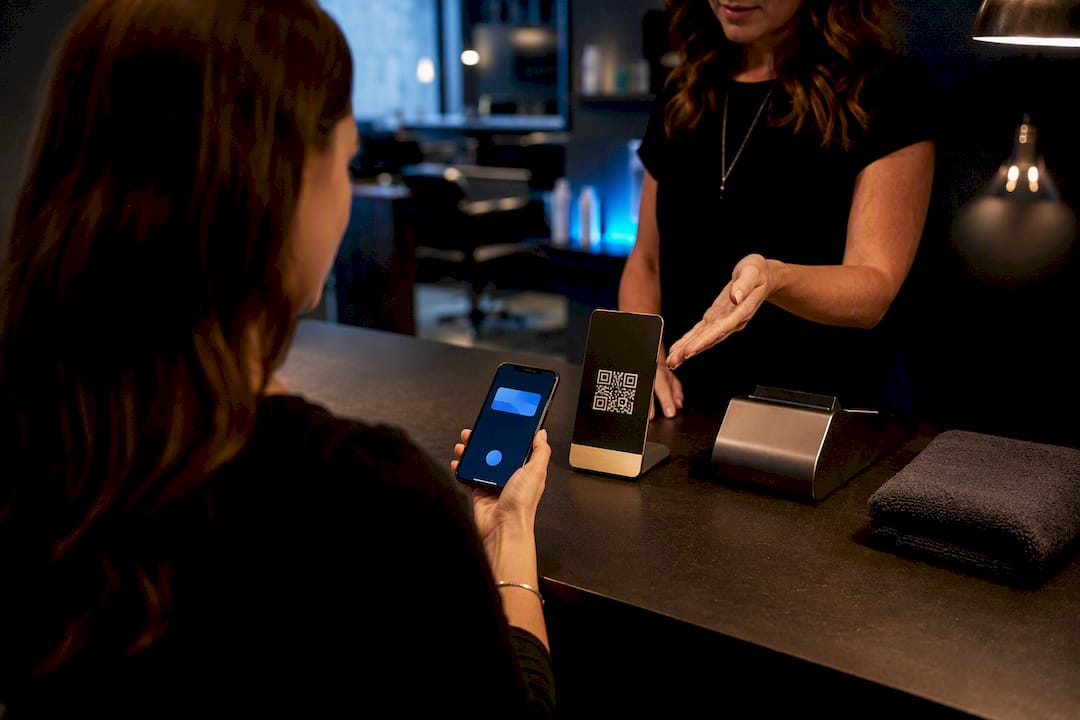 Client scanning salon loyalty QR code