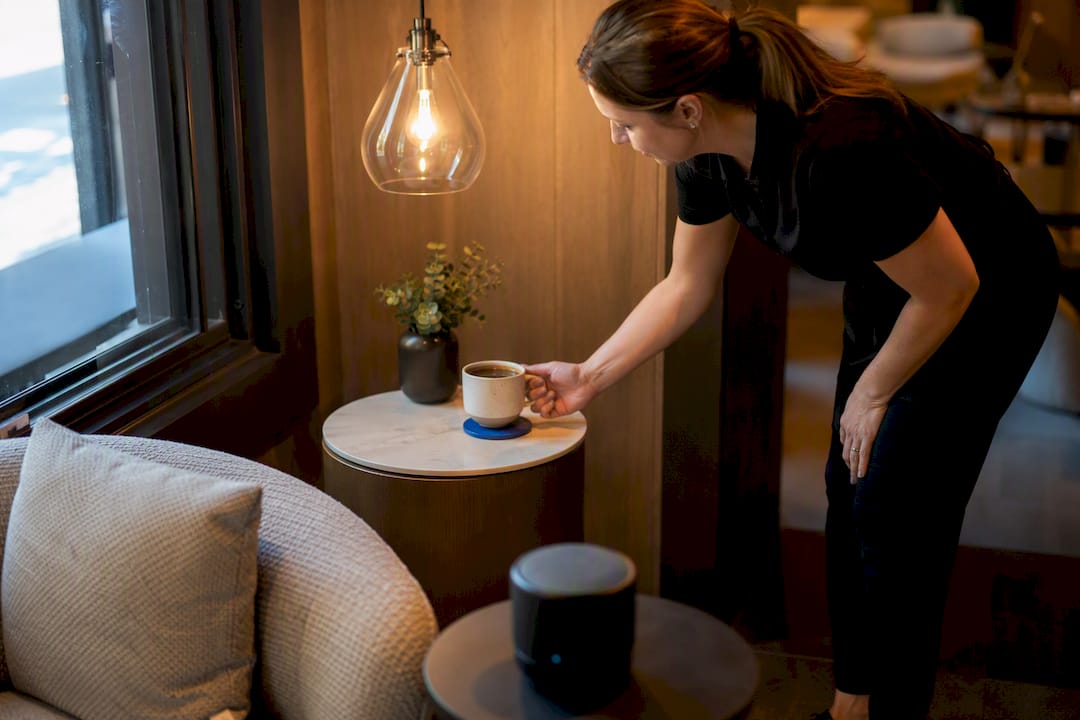 Salon waiting area with coffee and ambient speaker