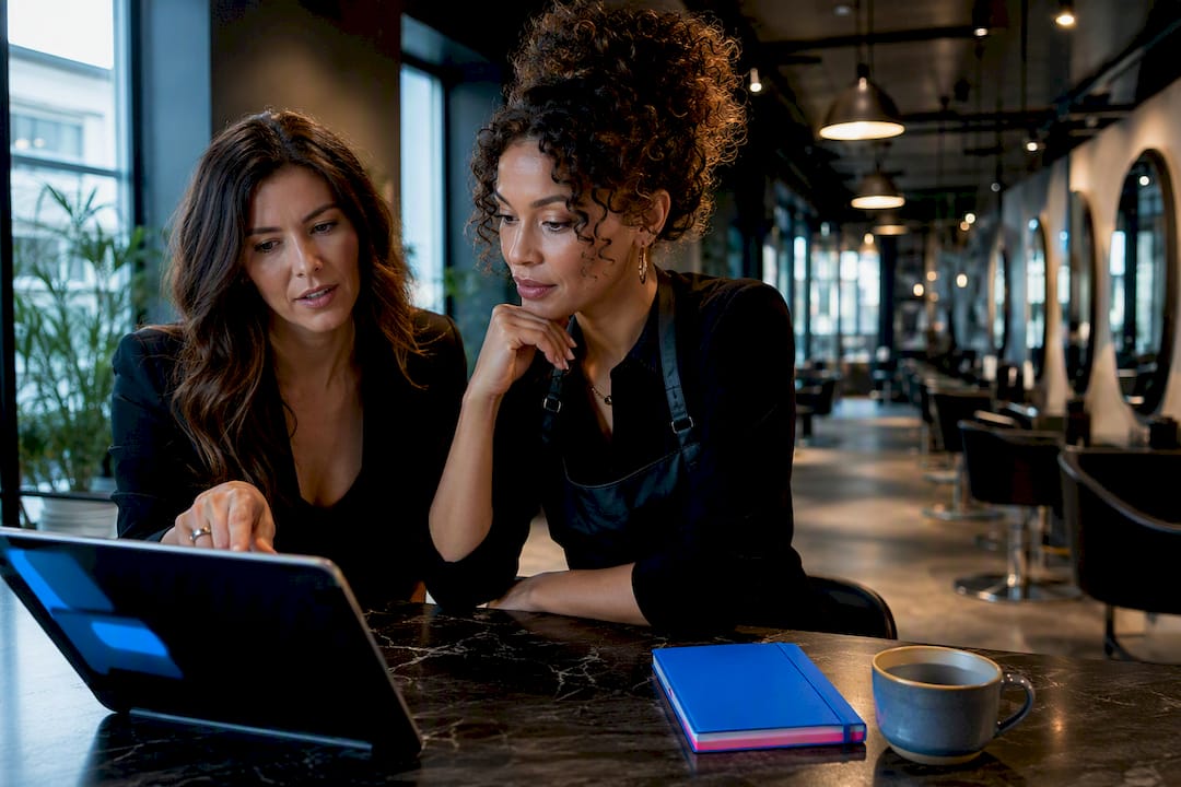 Salon team reviewing branded client portal