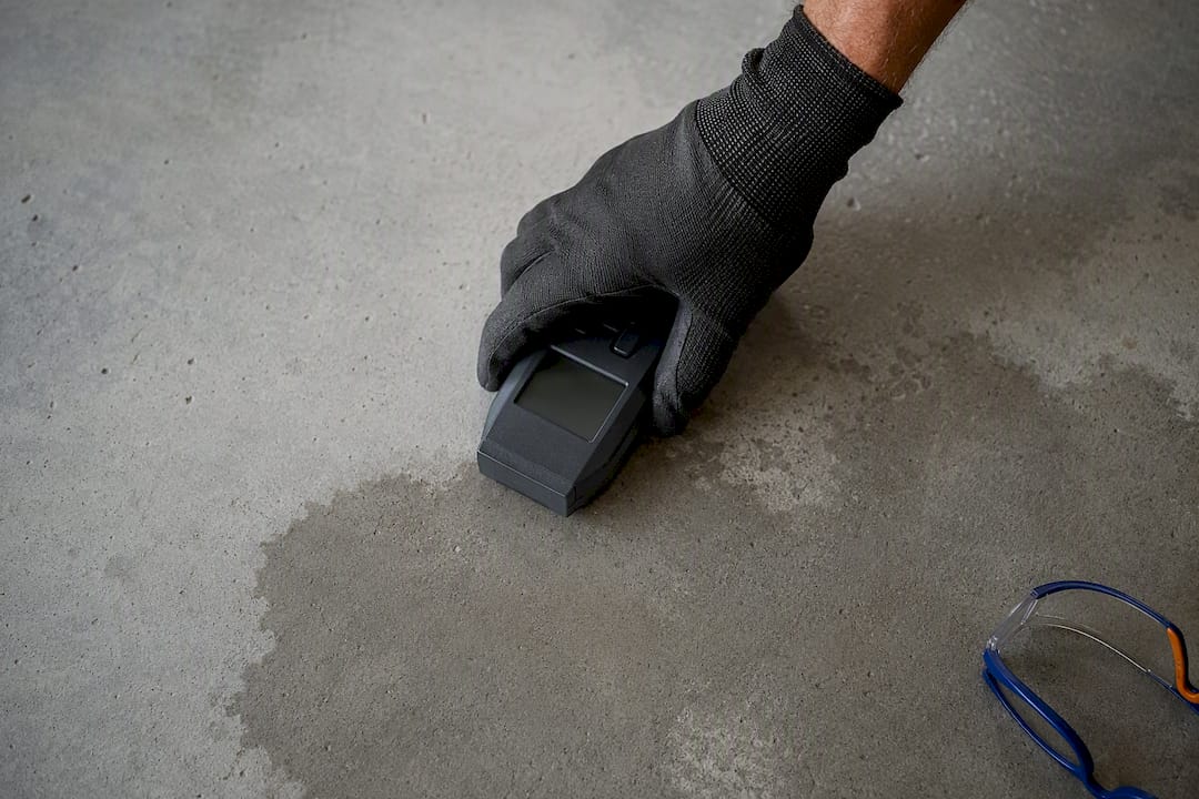 Moisture meter checking a concrete slab