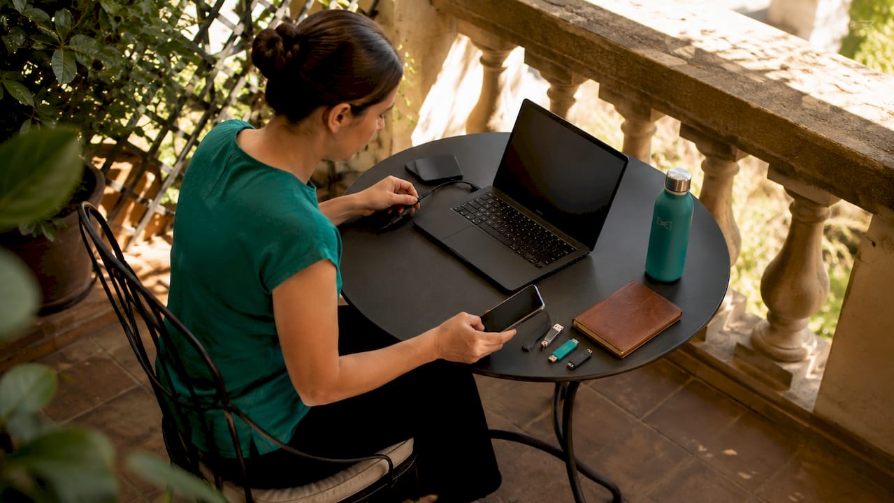 IT technician configuring laptop for onboarding