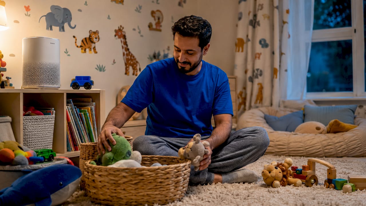 Father and air purifier in child's bedroom