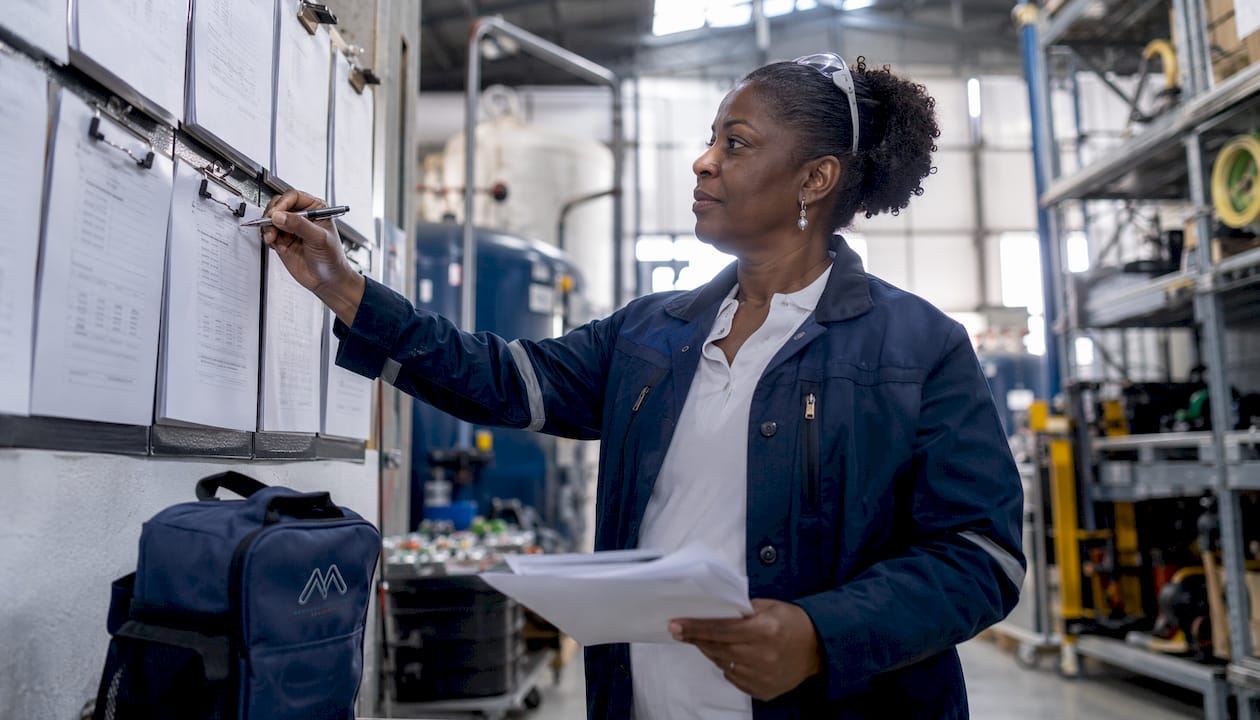 Female facilities manager reviewing water hygiene KPI reports