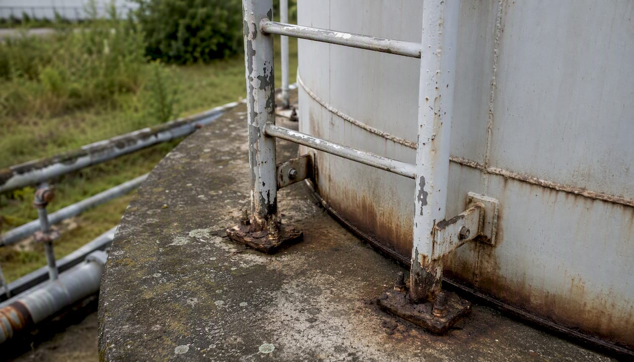 Corroded ladder anchor on water tank