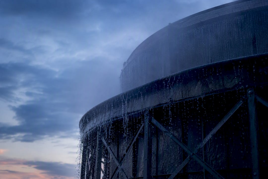 Cooling tower emitting mist with water droplets