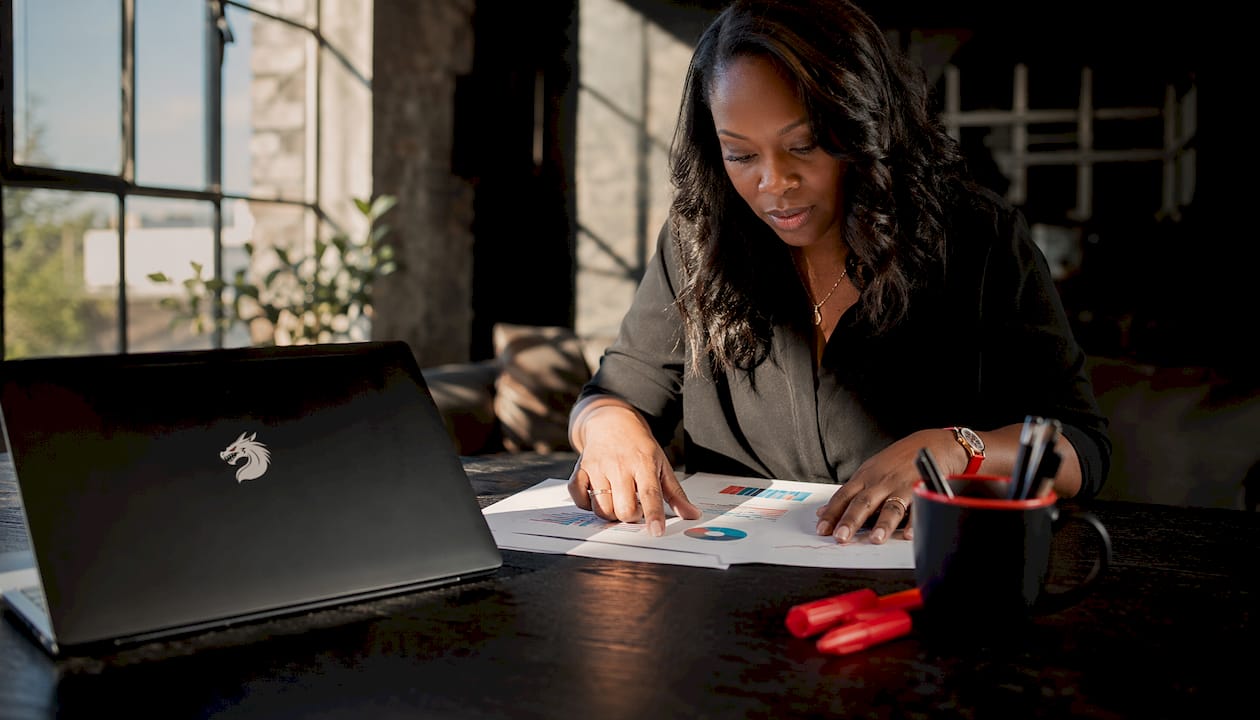 SEO consultant analyzing printed ranking report