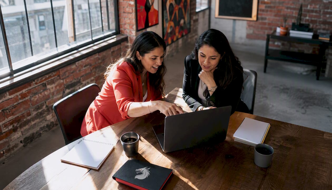 Two women discussing digital marketing strategy