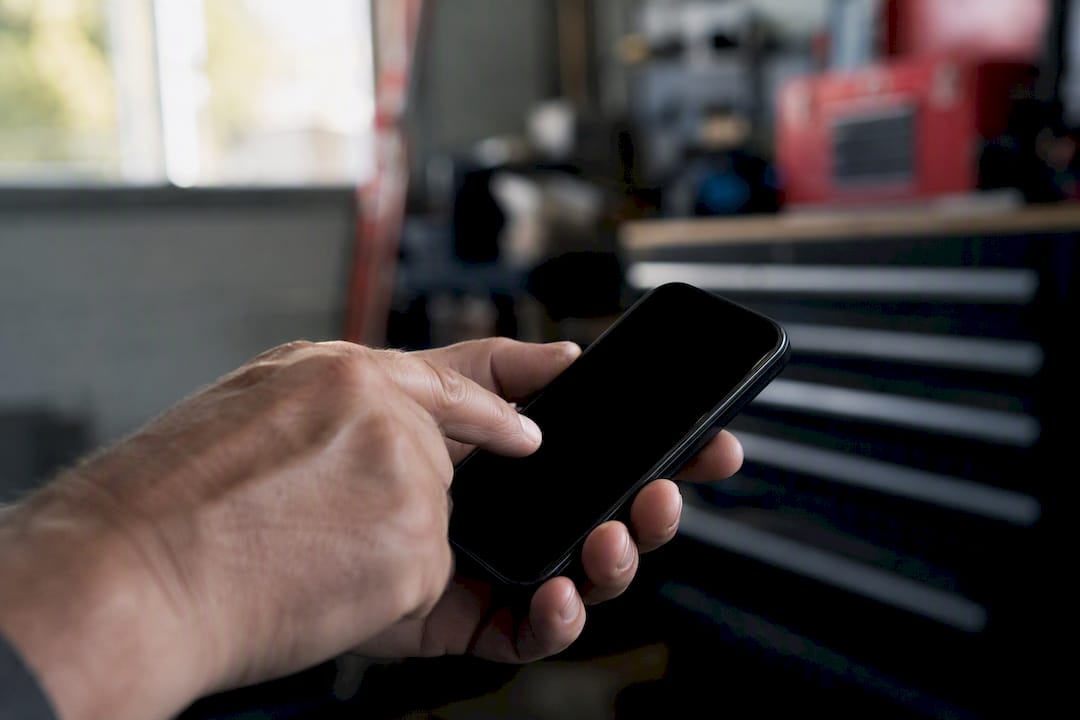 Contractor tapping phone number button