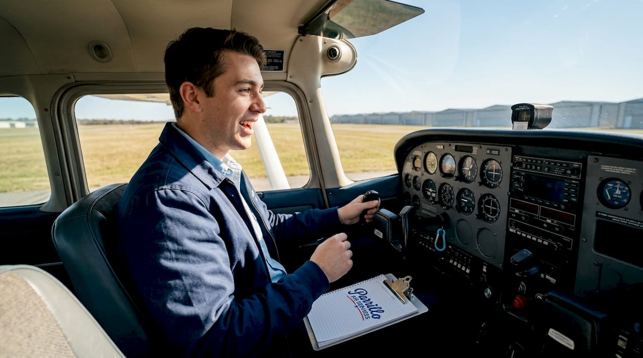 Beginner pilot in airplane cockpit before flight