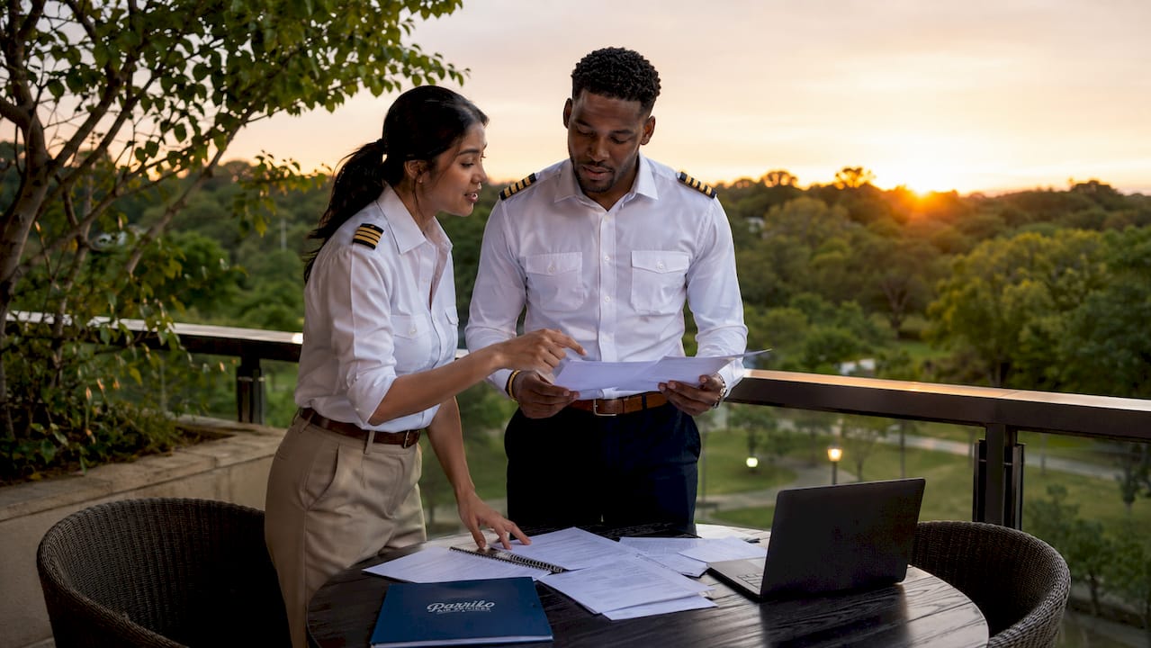 Pilots discussing union agreements in meeting room