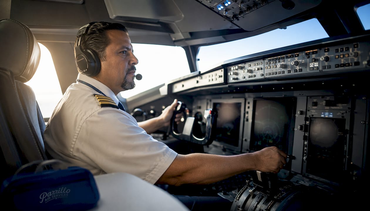 Pilot training inside full flight simulator cockpit