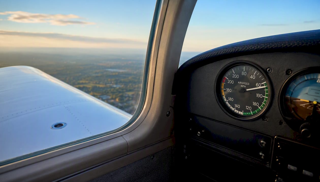 Aircraft wing and airspeed indicator in flight