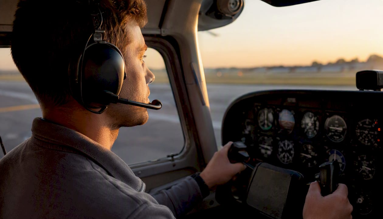Adult student pilot training flight cockpit