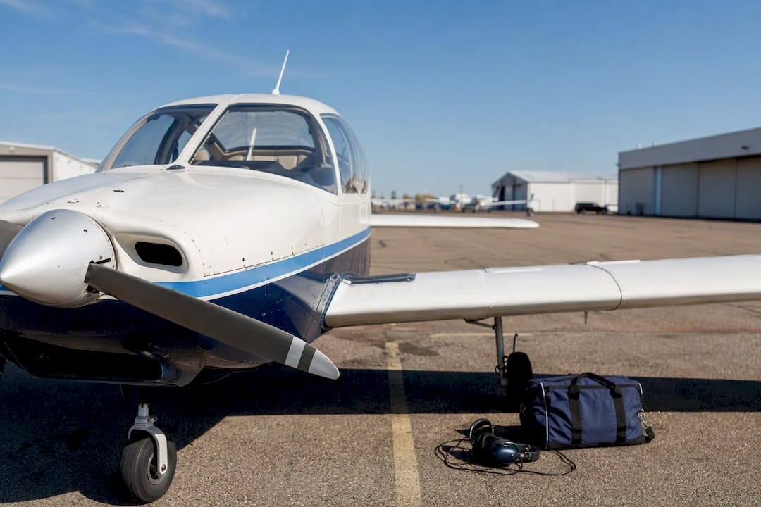 Partial view of light training aircraft on ramp