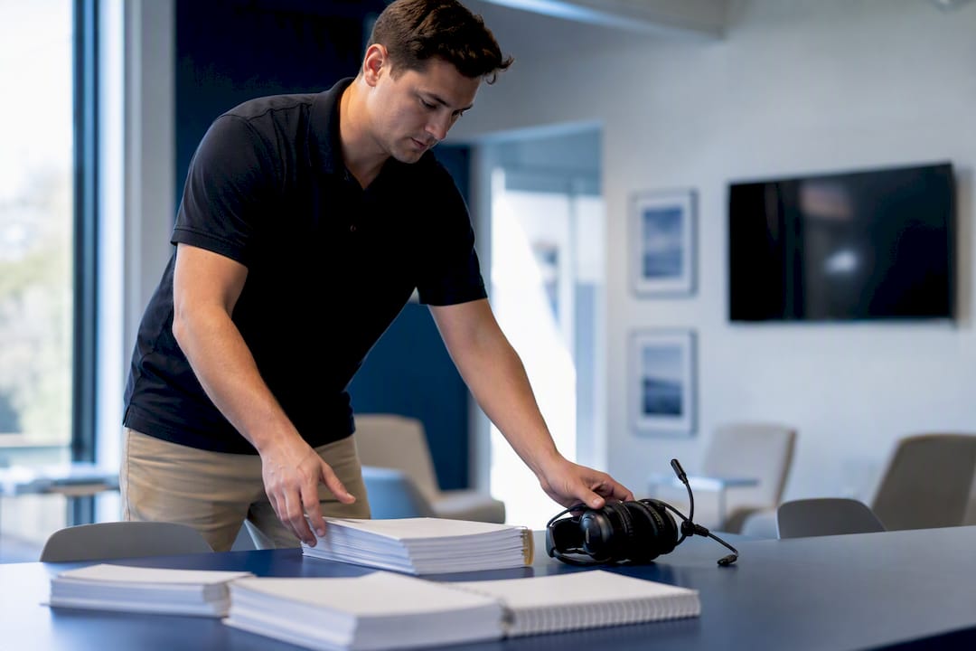 Instructor setting up flight training materials