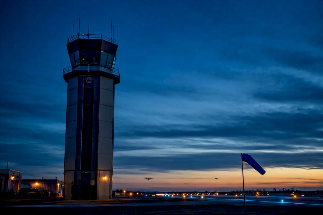 Airport control tower against evening sky