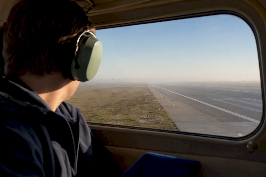 Hazy runway viewed by student pilot