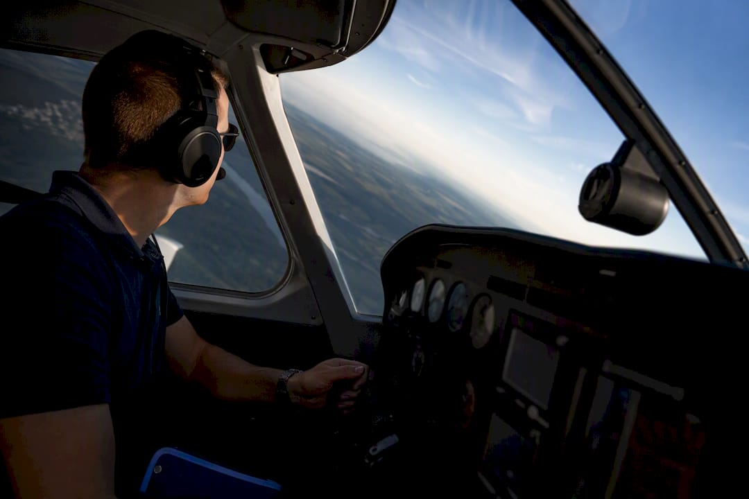 Student pilot cross-checking instruments during maneuver