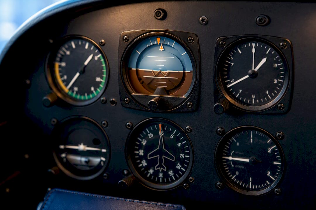 Central attitude indicator surrounded by flight instruments