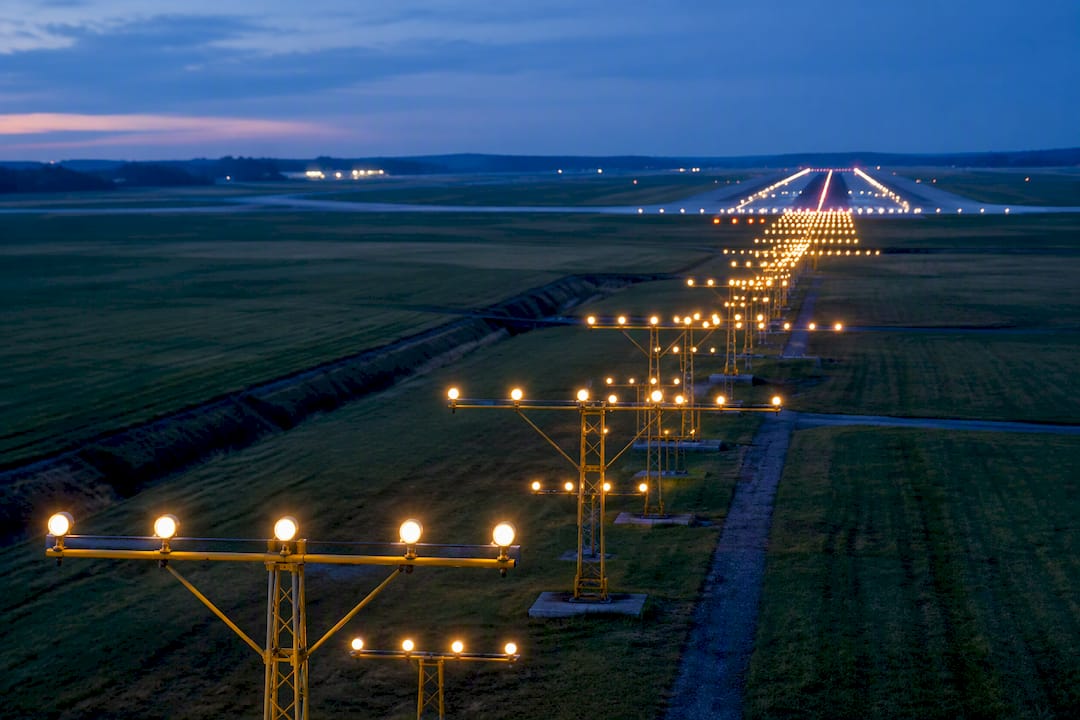Airport approach lights leading toward runway