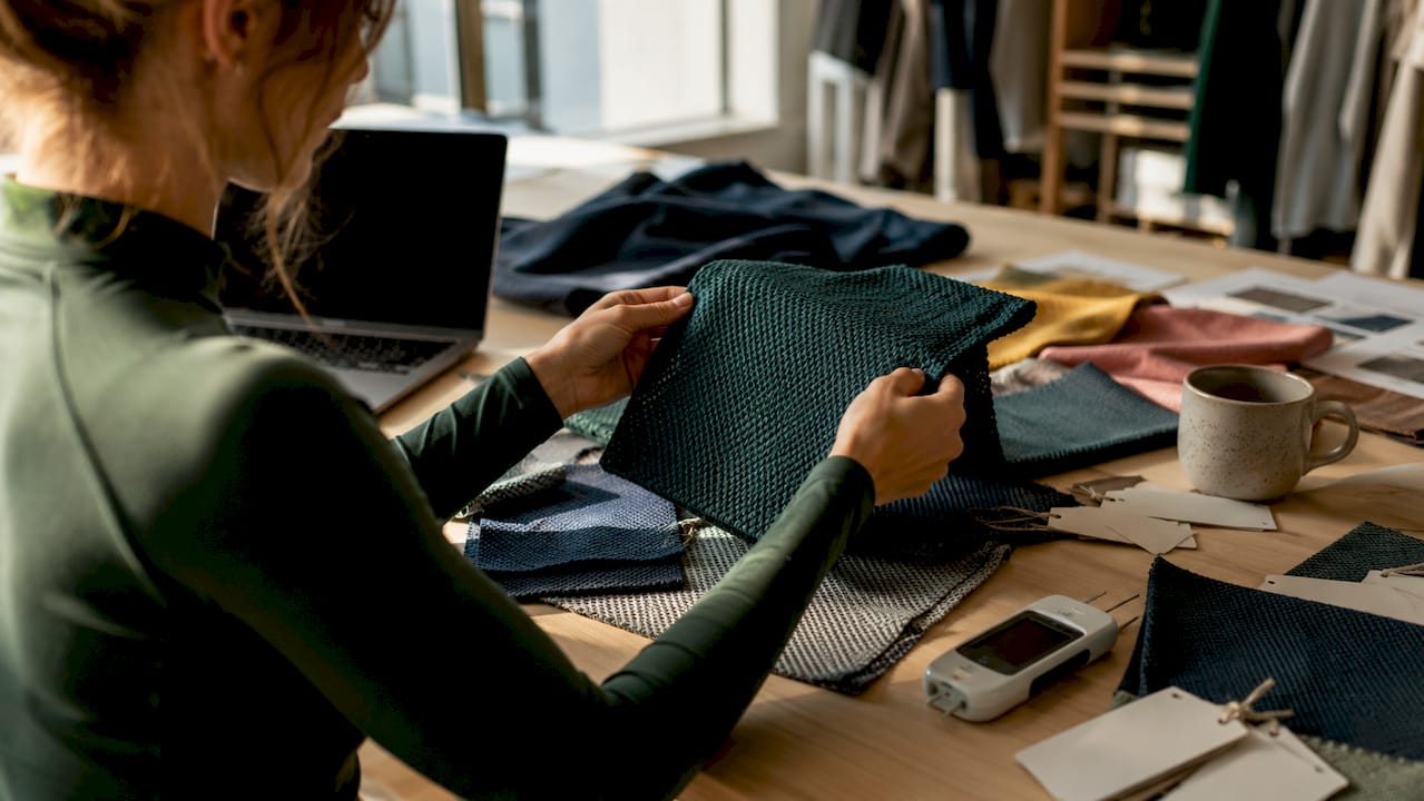 Hands testing advanced workout fabric samples