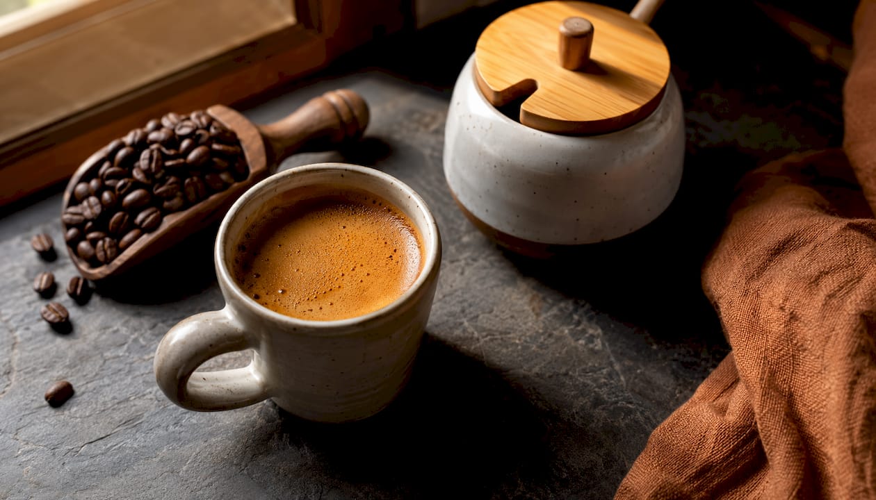Close-up of espresso cup with thick crema foam