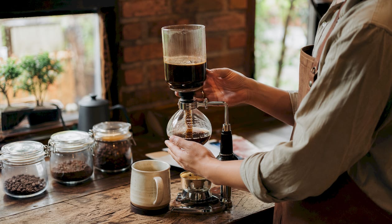 Close-up of coffee dripping into cup