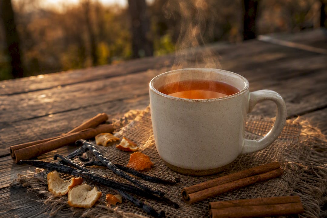 Steaming rooibos tea with vanilla and orange peels