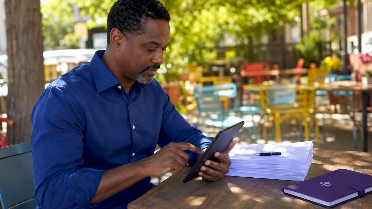 Hands using tablet for purchase order processing