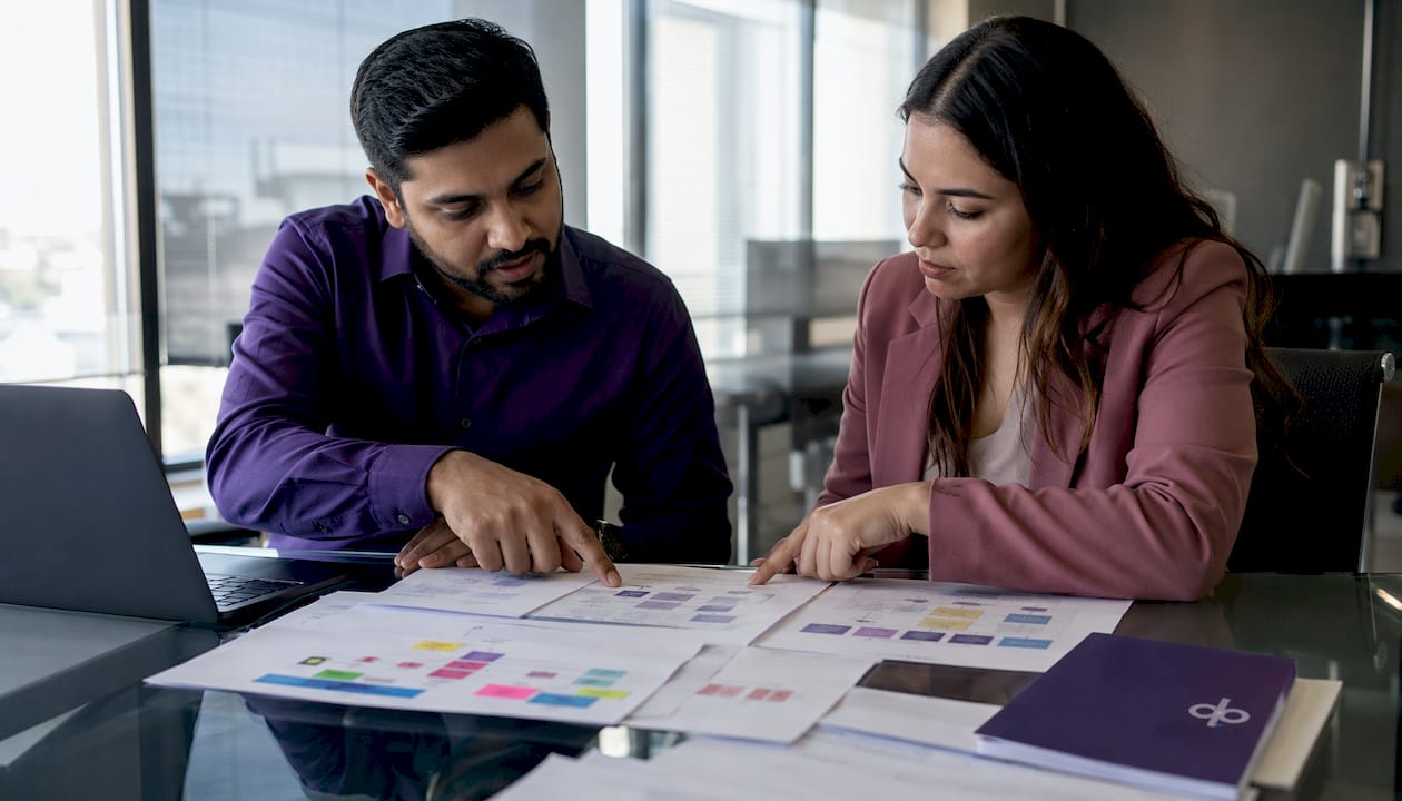 Collaborators reviewing contract automation implementation documents