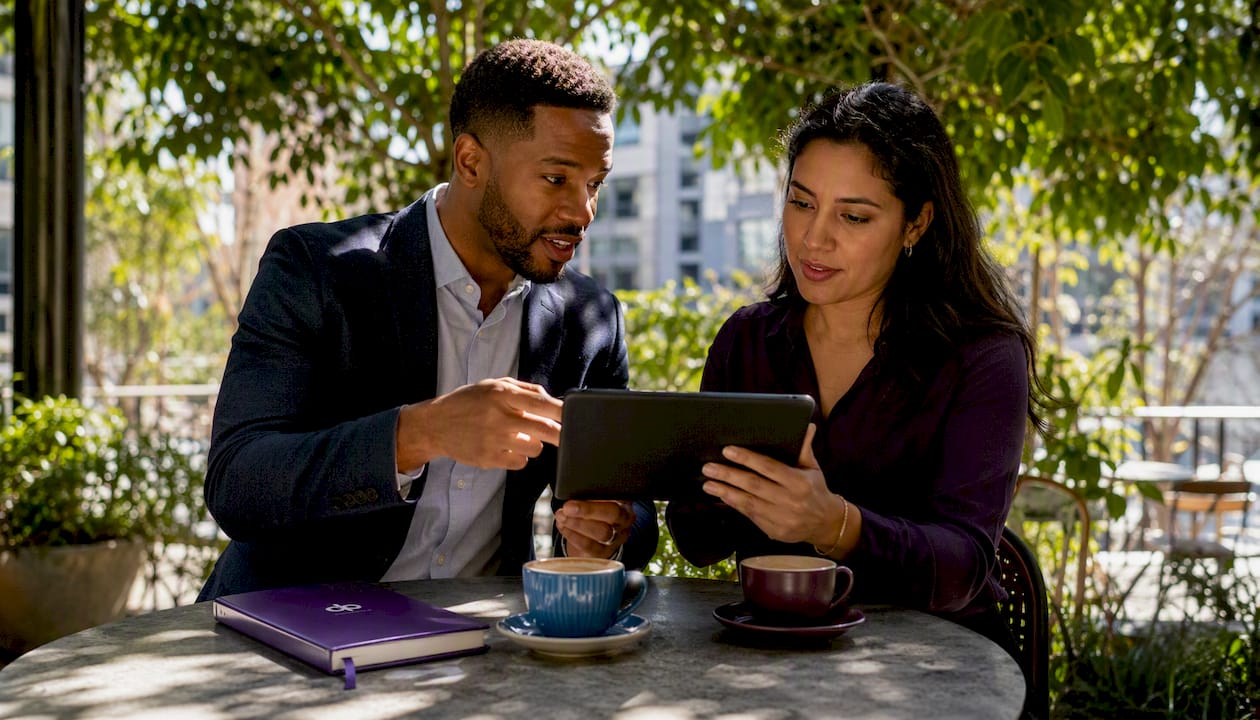 Two professionals discussing AI knowledge base