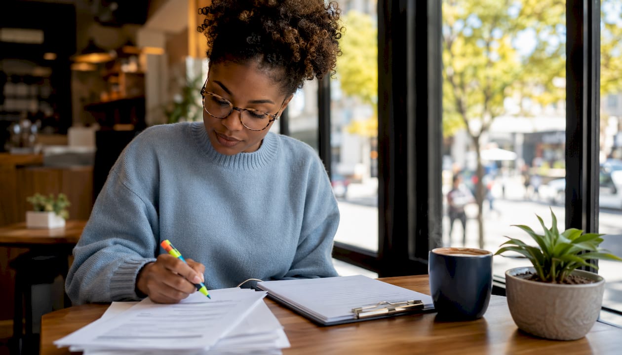 Recruiter reviewing trucking driver applications indoors