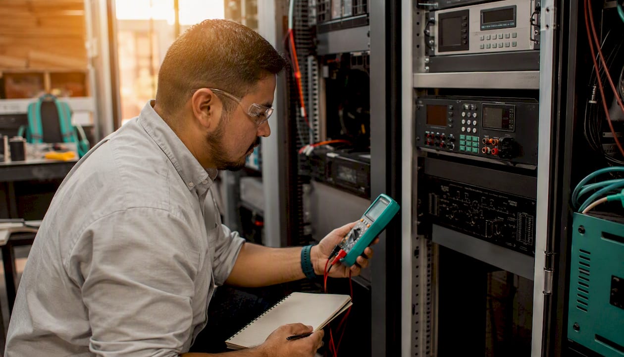 Technician calibrating NXT Power conditioning unit