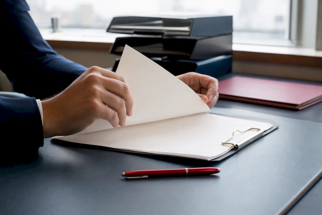Hands stamping moving broker form