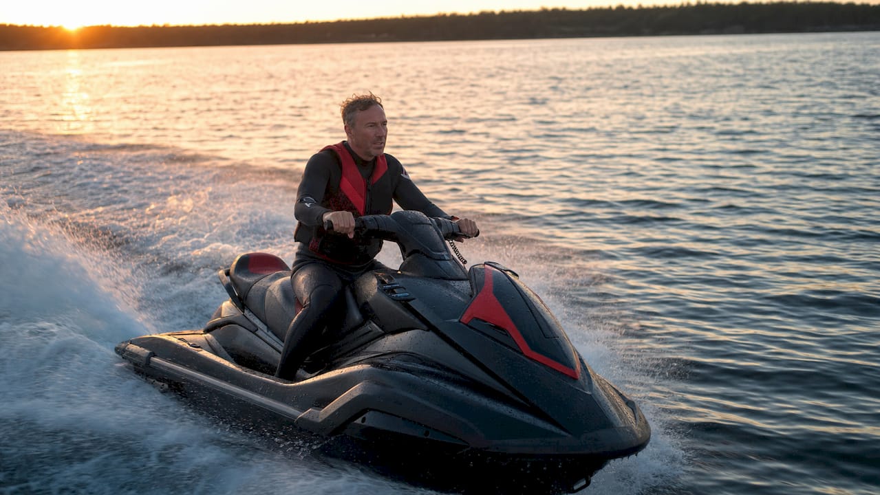 Man testing jet ski performance on water